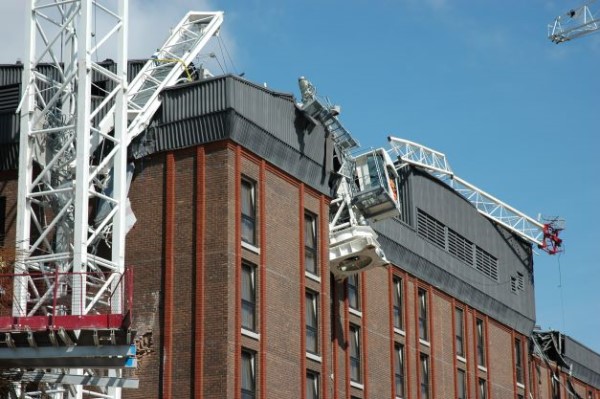 Crane fallen on building