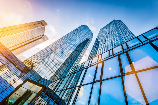 looking up at skyscrapers