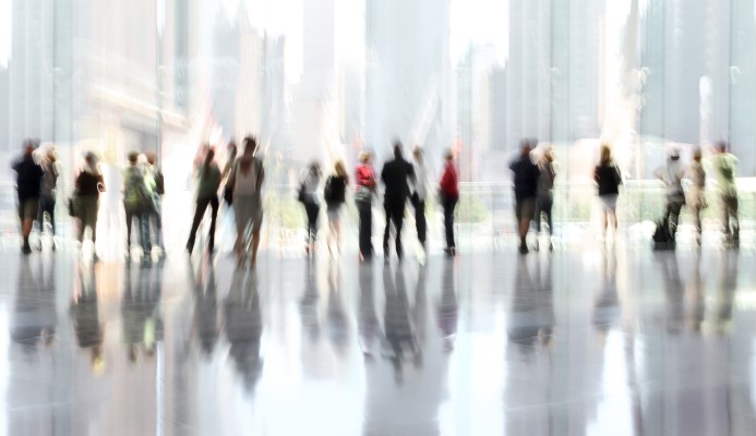 Blurry people in office building