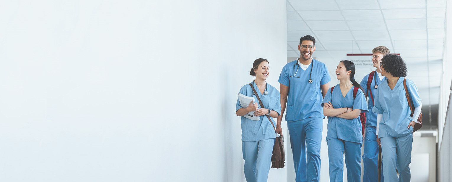 Healthcare professionals walking down hallway